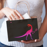 Woman holding tennis dinosaur gift bag